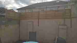 Timber screening on top of wall