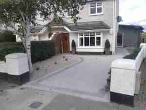 Image of the new driveway widened and grass area gravelled and planted