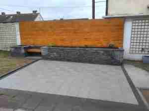 Image of raised bed and timber larch cladding, new silver granite patio